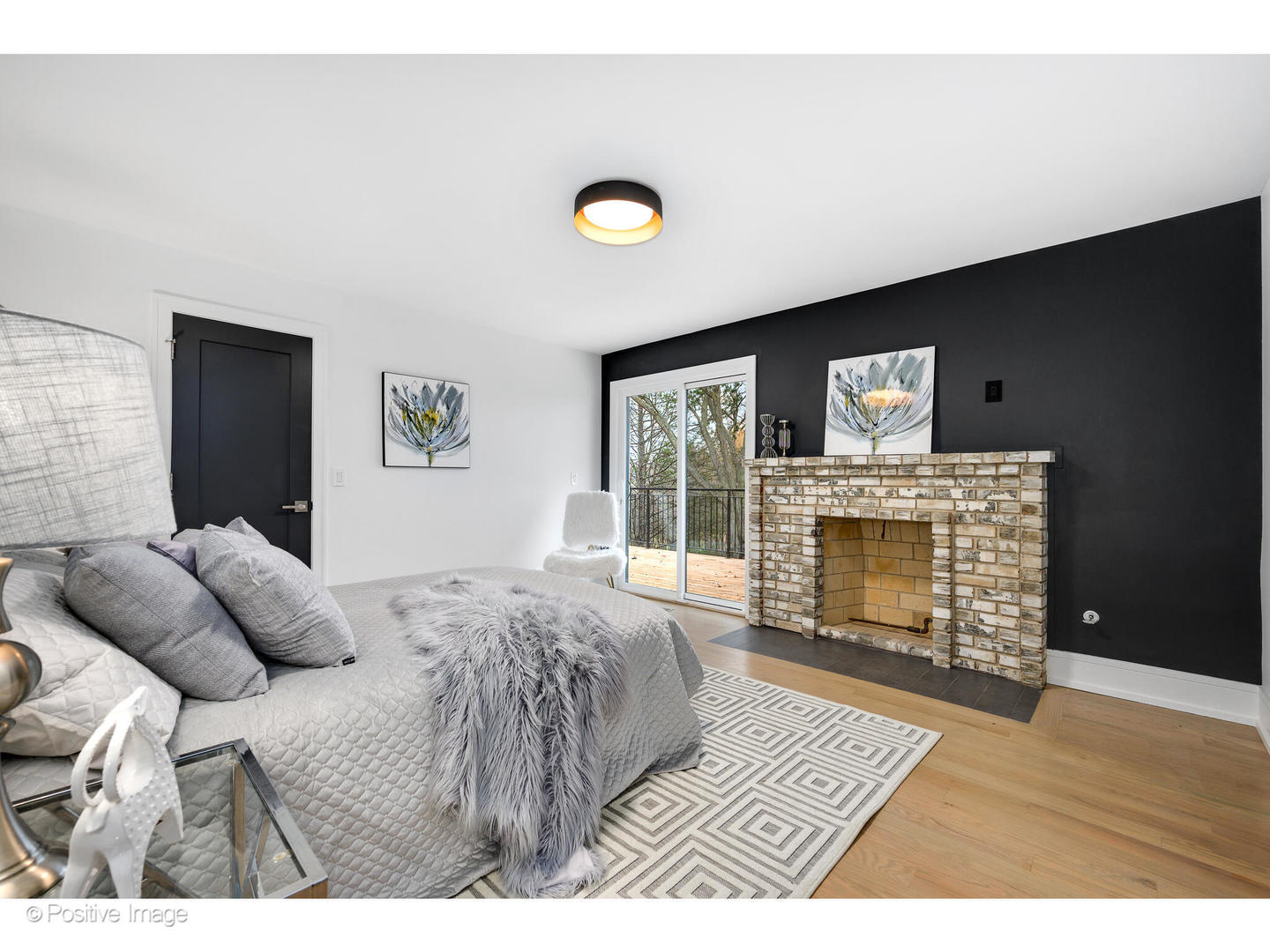 2005 Malory Lane Highland Park, IL 60035 - Photo 32 of 48 a bedroom with a bed and a fireplace