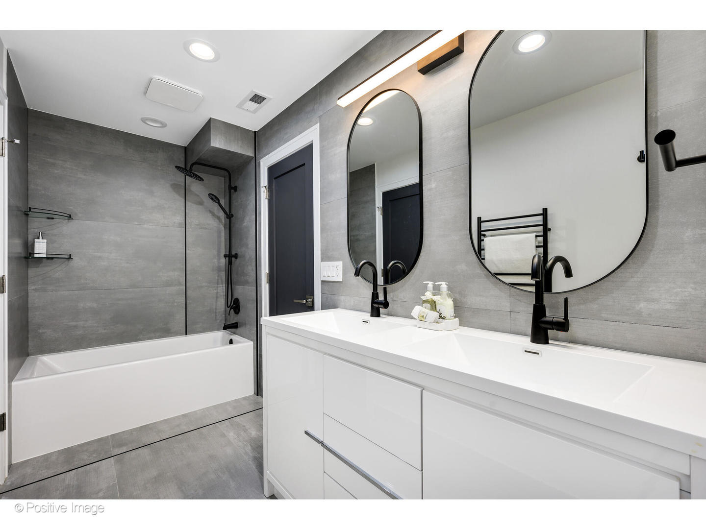 2005 Malory Lane Highland Park, IL 60035 - Photo 33 of 48 a bathroom with a sink and a mirror