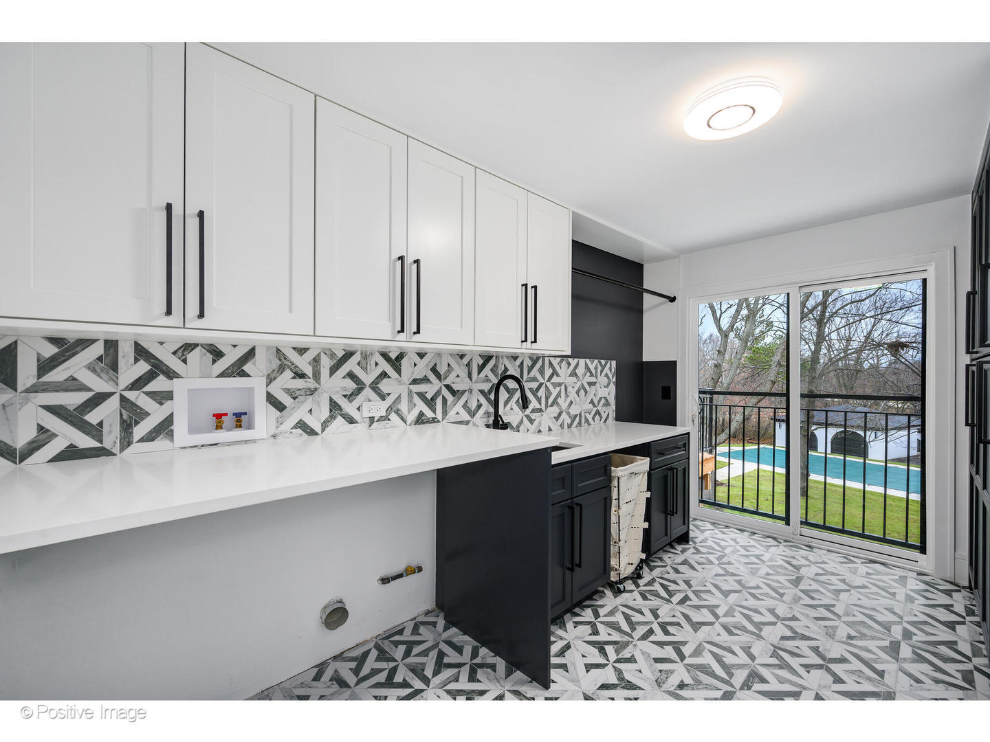 2005 Malory Lane Highland Park, IL 60035 - Photo 36 of 48 a bathroom with a sink and a mirror