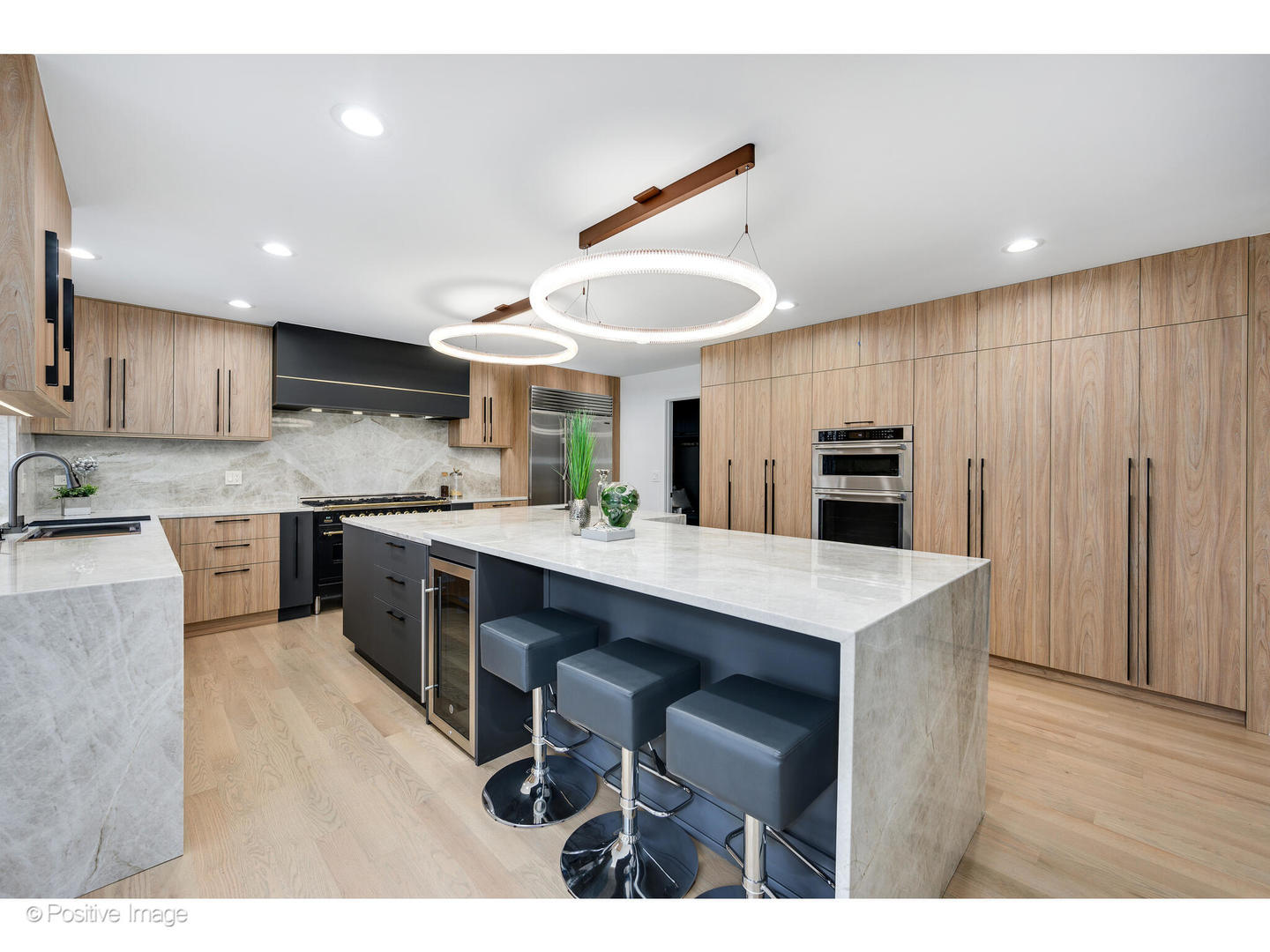 2005 Malory Lane Highland Park, IL 60035 - Photo 9 of 48 a kitchen with stainless steel appliances kitchen island granite countertop a table chairs sink and cabinets
