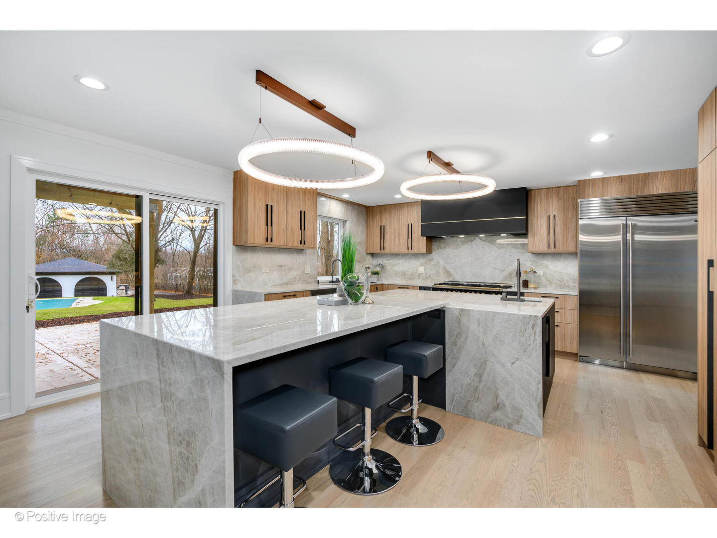 2005 Malory Lane Highland Park, IL 60035 - Photo 10 of 48 a kitchen with stainless steel appliances kitchen island a table chairs in it and wooden floors