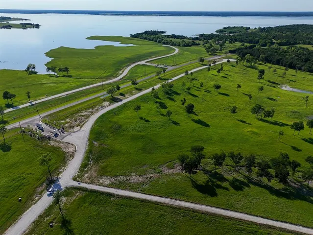 a view of a golf course with a houses
