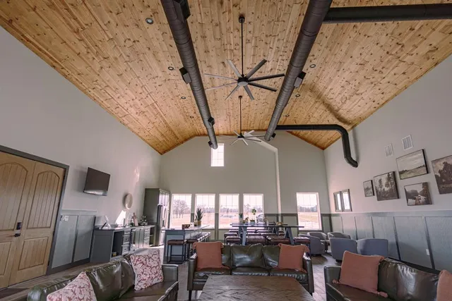 a view of a dining hall with furniture