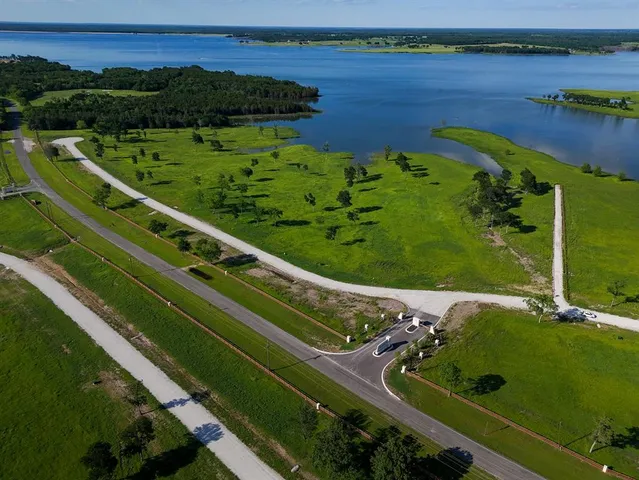 a view of a lake with a yard