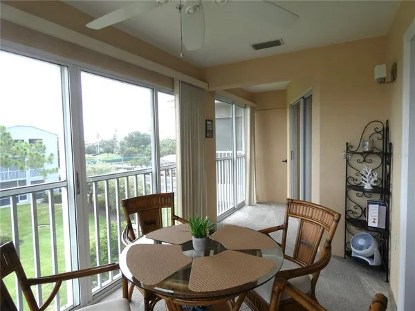 a view of a dining room with furniture window and outside view