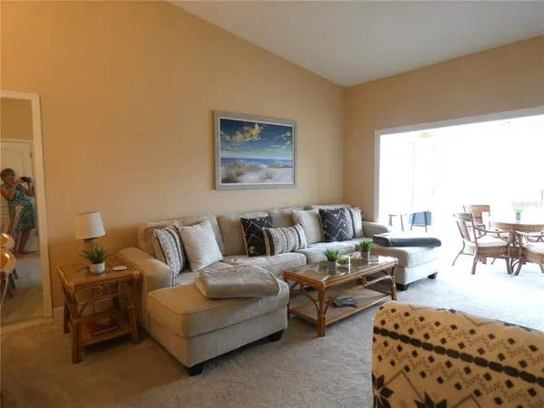 a living room with furniture and a table