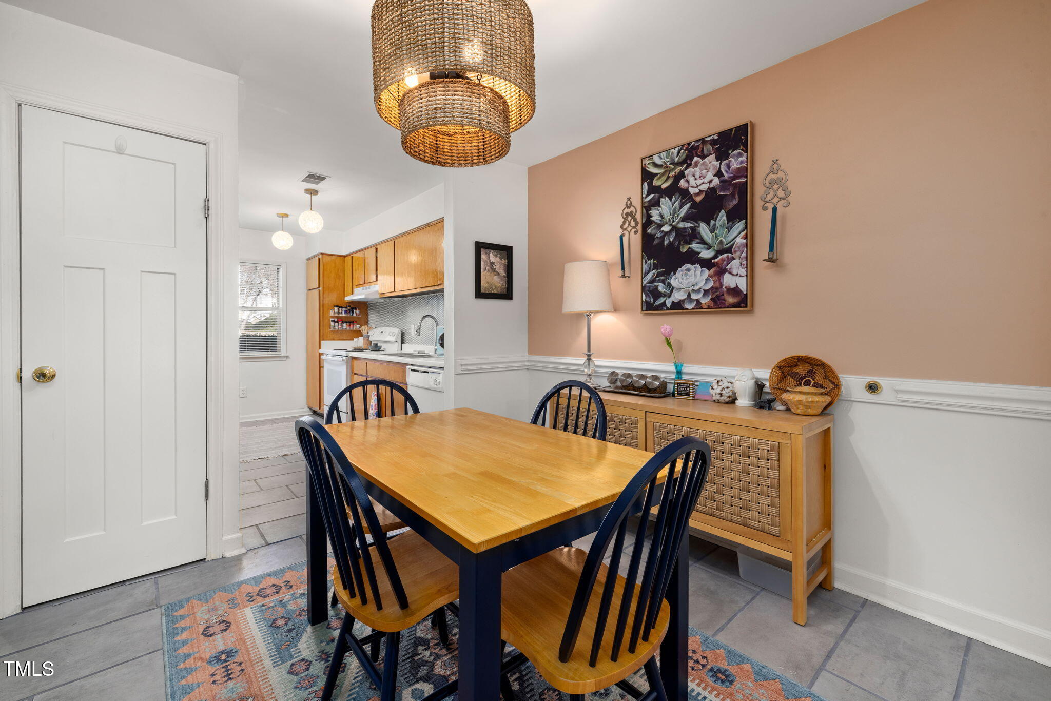 2520 Avent Ferry Road, Unit 103 Raleigh, NC 27606 - Photo 8 of 23 a view of a dining room with furniture and wooden floor