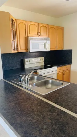 a dining room with table and chairs
