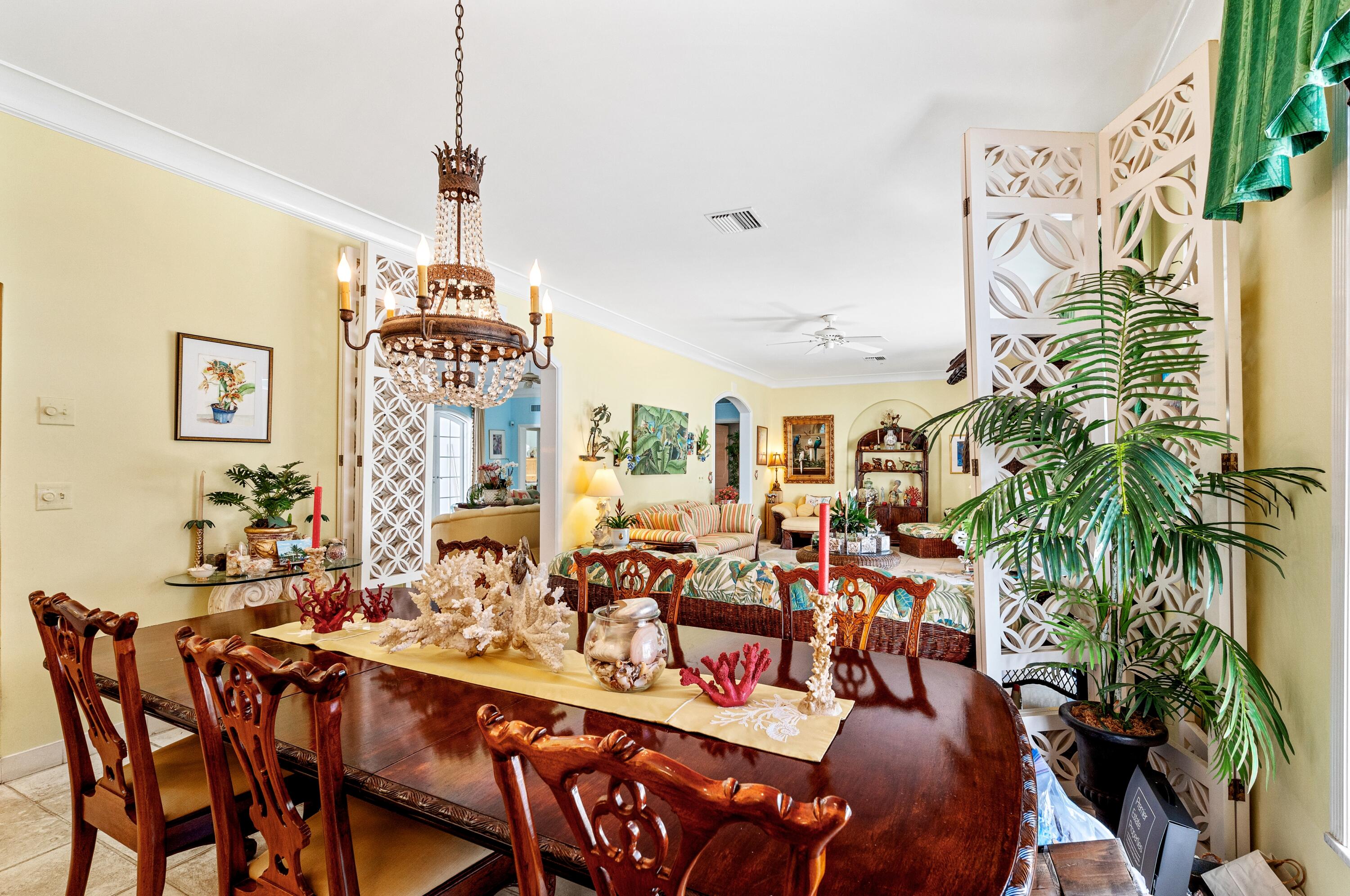 3224 North Ocean Boulevard Gulf Stream, FL 33483 - Photo 22 of 48 a very nice looking living room with a large window and potted plants