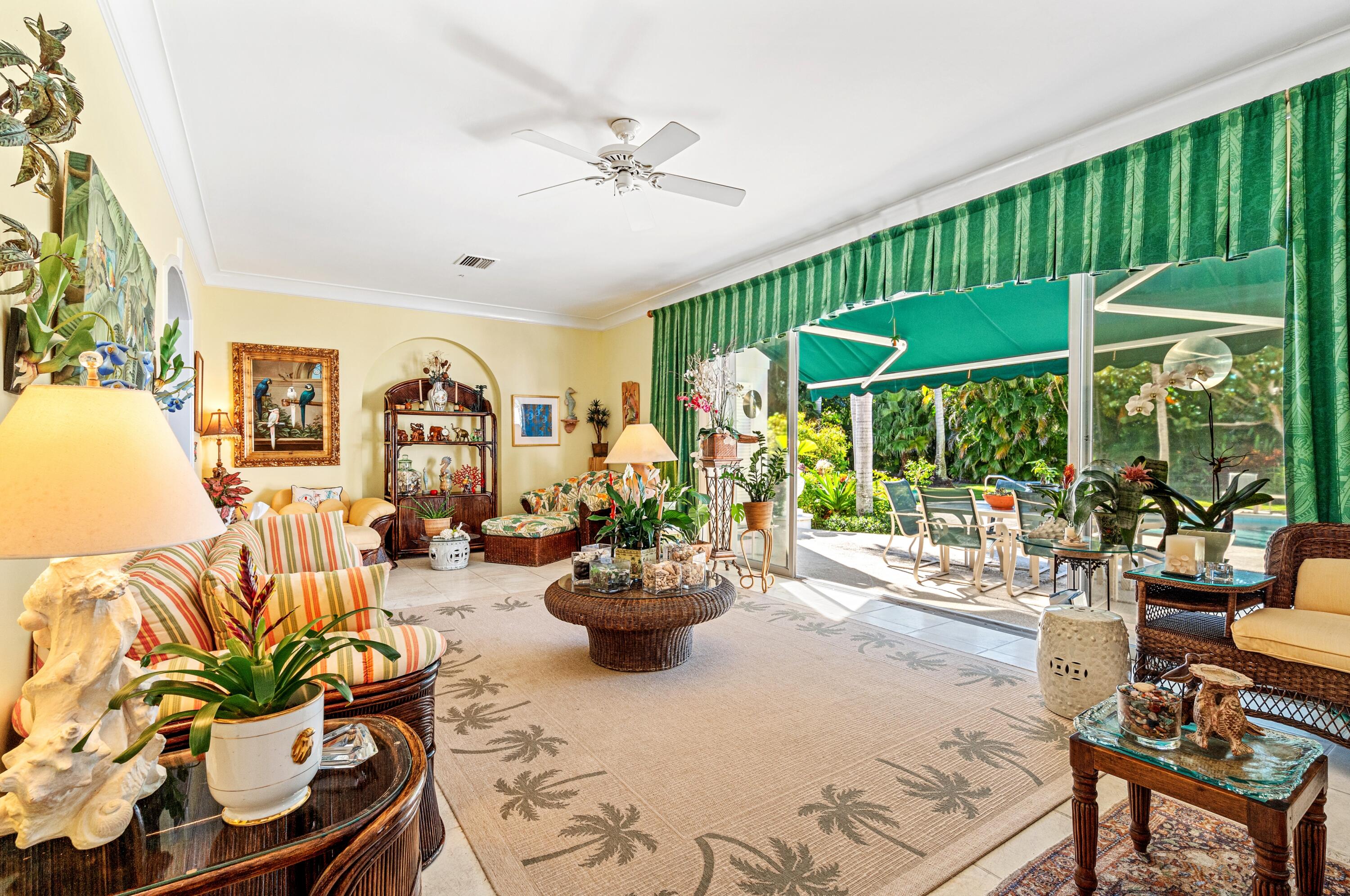 3224 North Ocean Boulevard Gulf Stream, FL 33483 - Photo 24 of 48 a living room with patio furniture and a potted plant