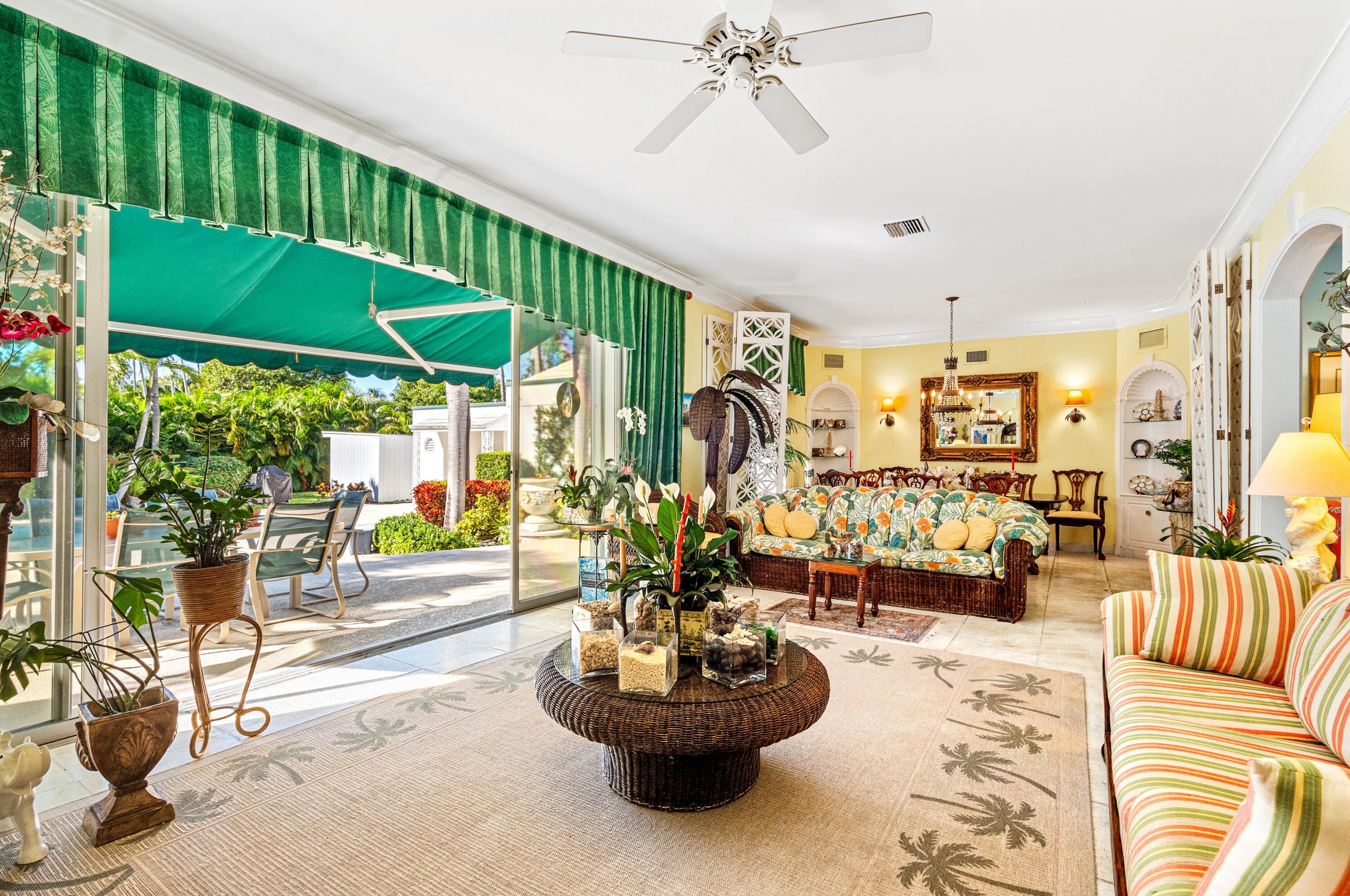 3224 North Ocean Boulevard Gulf Stream, FL 33483 - Photo 25 of 48 a living room with furniture and a large window