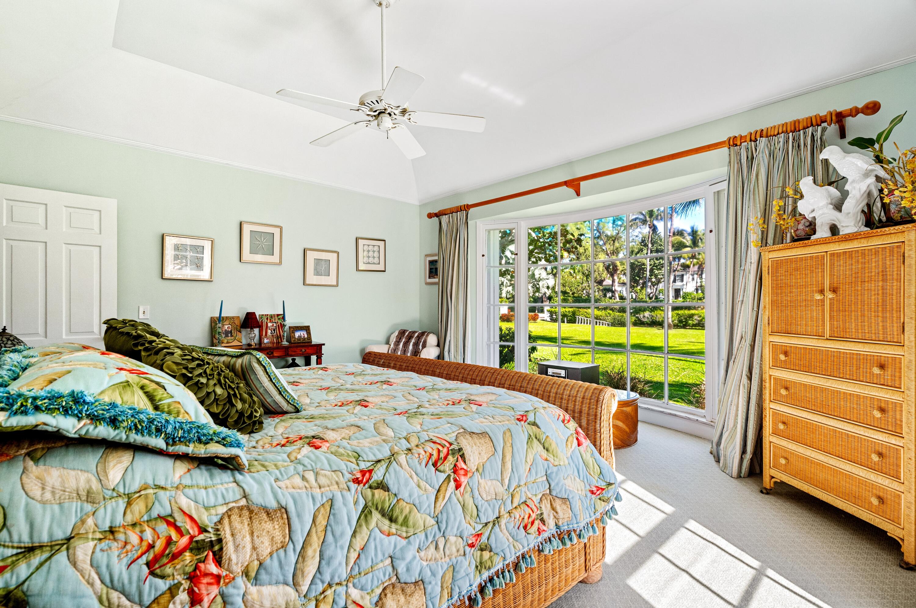 3224 North Ocean Boulevard Gulf Stream, FL 33483 - Photo 29 of 48 a bedroom with a bed and wooden floor
