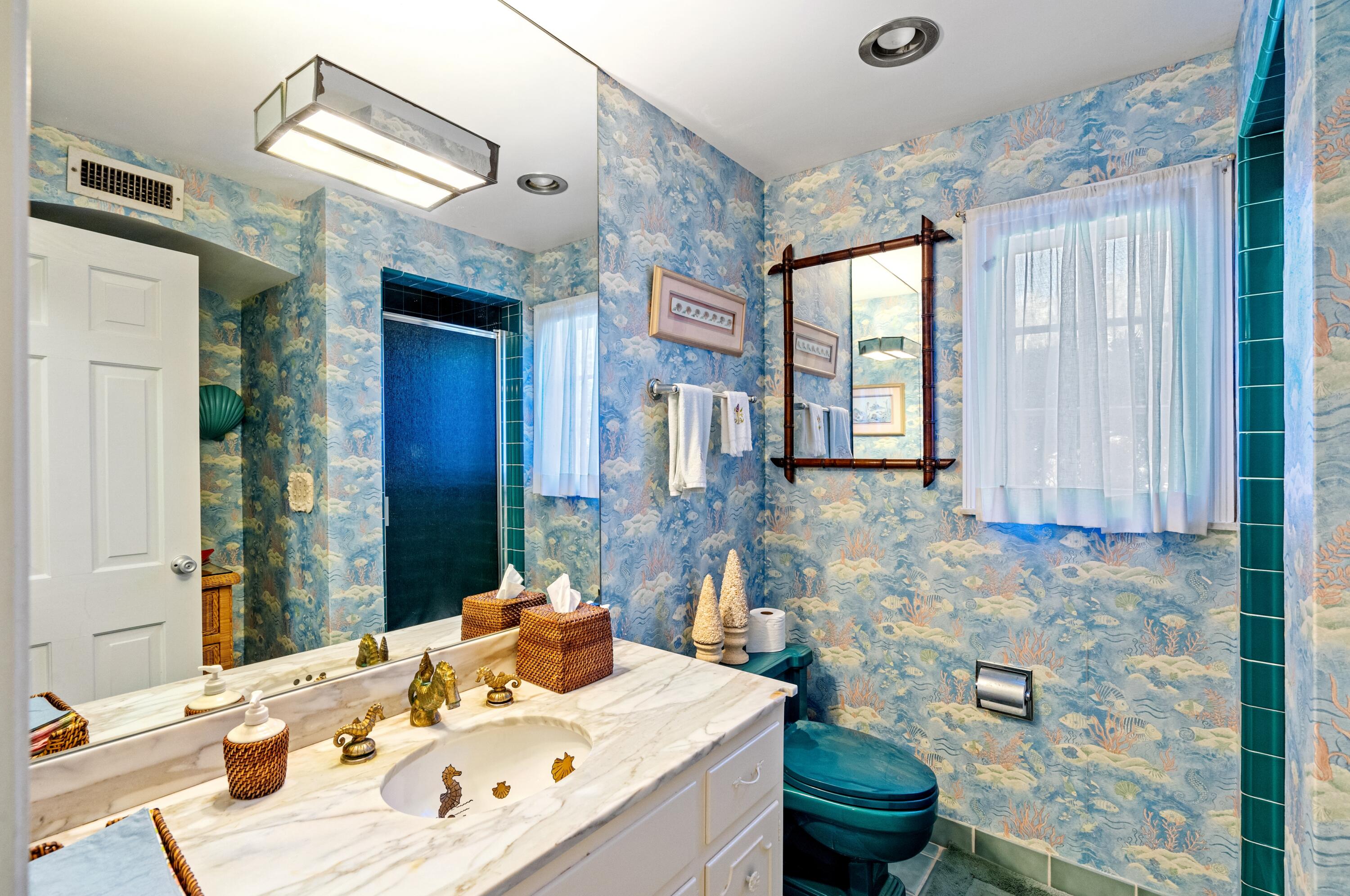 3224 North Ocean Boulevard Gulf Stream, FL 33483 - Photo 33 of 48 a bathroom with a sink double vanity and a mirror