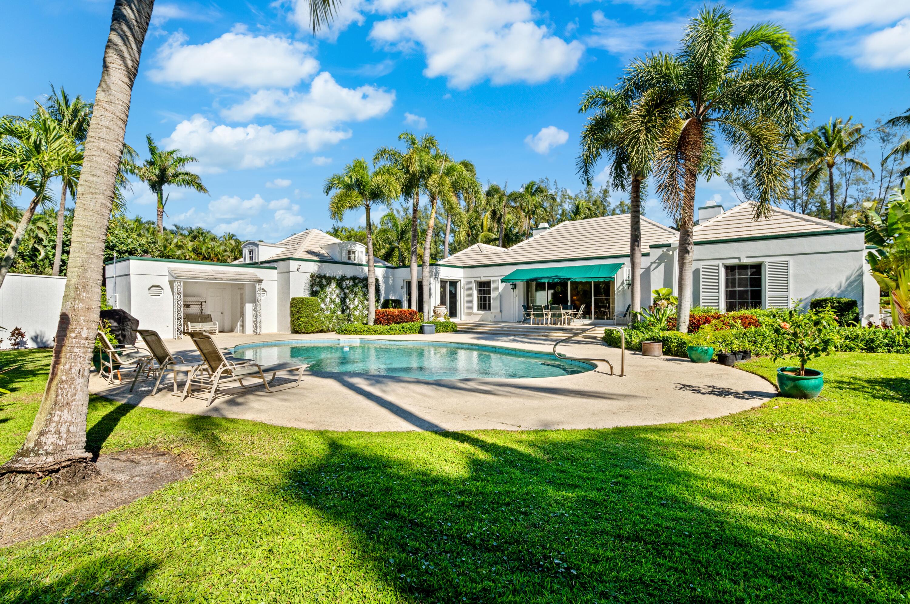 3224 North Ocean Boulevard Gulf Stream, FL 33483 - Photo 36 of 48 a view of a house with swimming pool and sitting area