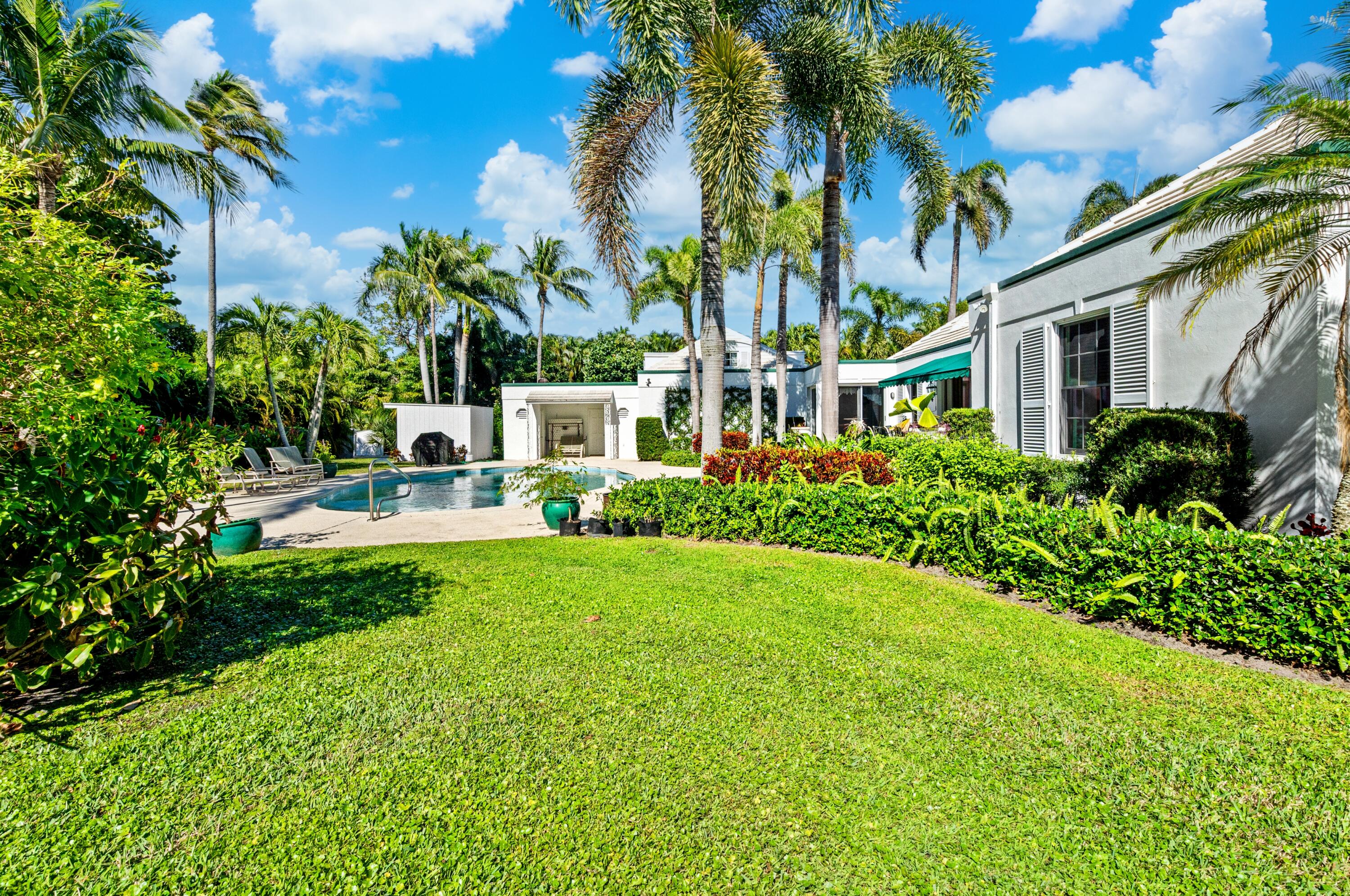 3224 North Ocean Boulevard Gulf Stream, FL 33483 - Photo 41 of 48 a front view of a house with garden
