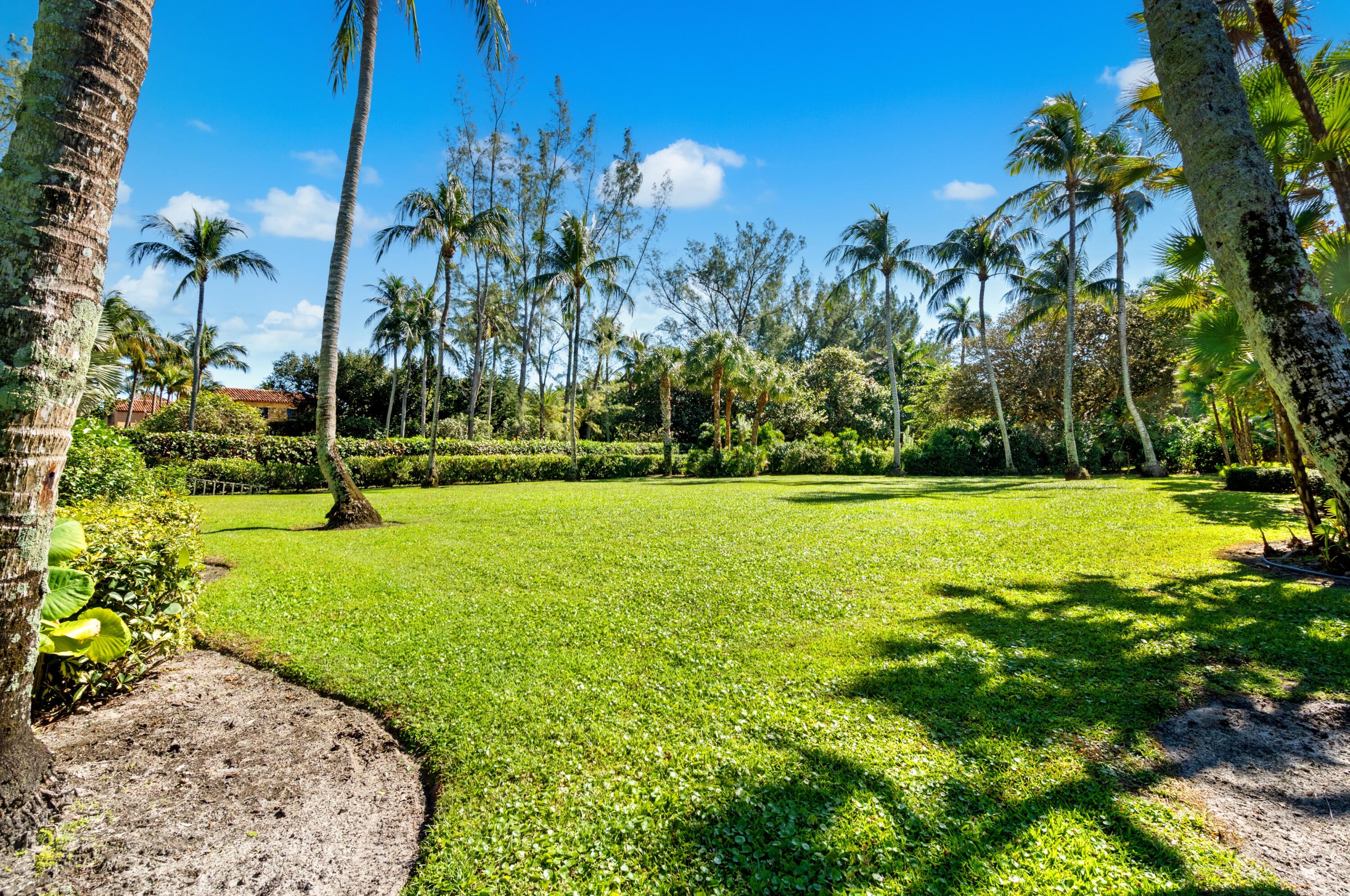 3224 North Ocean Boulevard Gulf Stream, FL 33483 - Photo 42 of 48 a view of a garden with a fountain