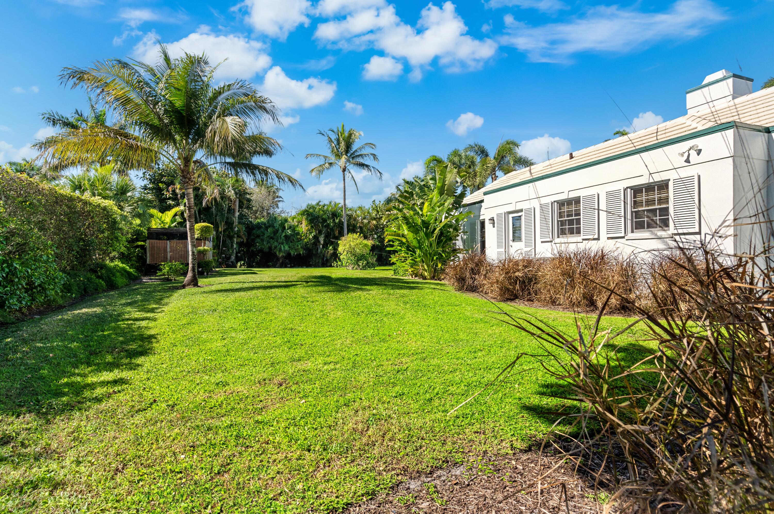 3224 North Ocean Boulevard Gulf Stream, FL 33483 - Photo 43 of 48 a front view of a house with garden