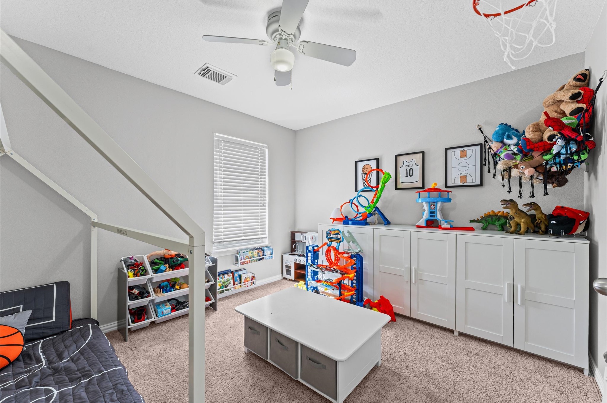 618 Cypresswood Trace Spring, TX 77373 - Photo 13 of 24 a children room with toys and a chandelier