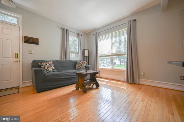 a white toilet sitting next to a sink
