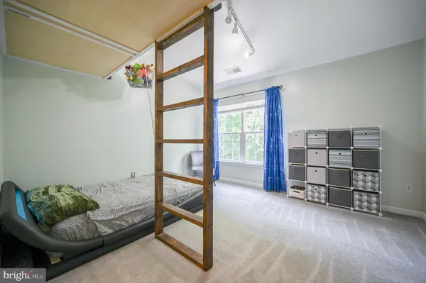 an empty room with staircase and white walls