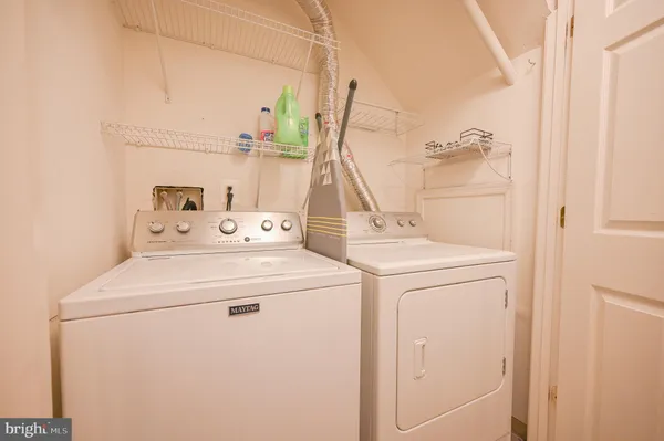 a view of a house with porch and garden