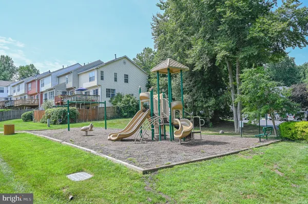 an outdoor space with swimming pool and furniture