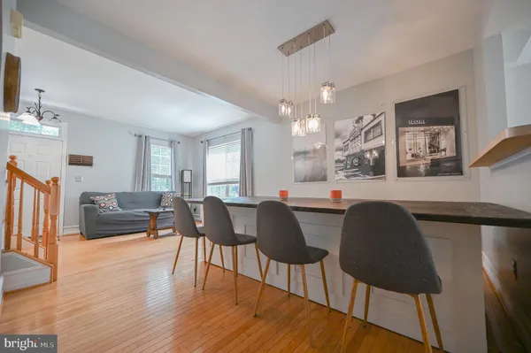a view of balcony with wooden floor and outdoor seating