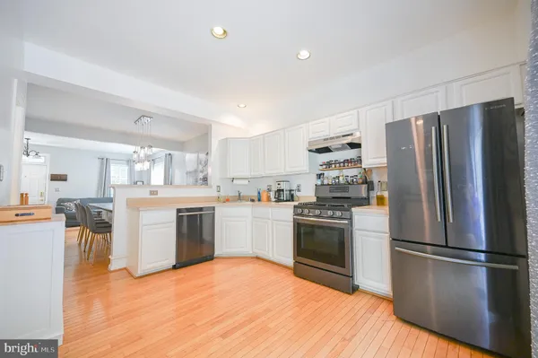 a view of a livingroom with furniture and a flat screen tv