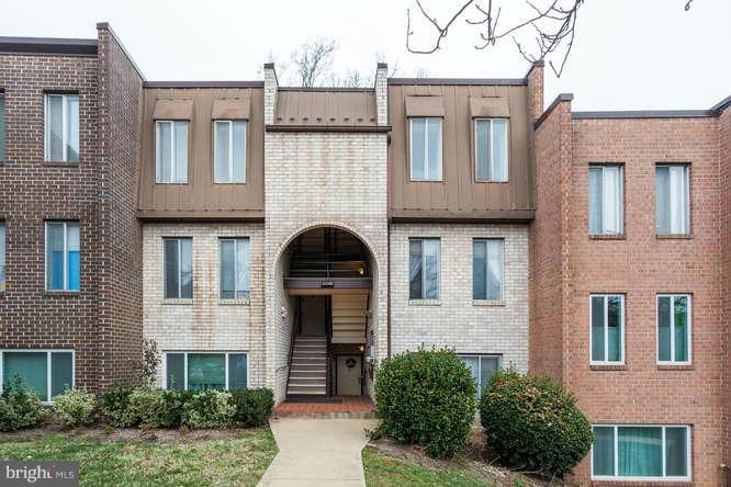 5049 7th Road South, Unit 302 Arlington, VA 22204 - Photo 1 of 26 a front view of a house with garden