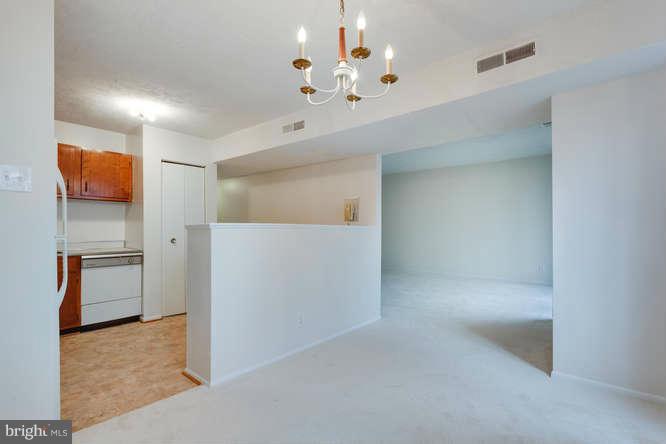 5049 7th Road South, Unit 302 Arlington, VA 22204 - Photo 14 of 26 a view of a hallway with a chandelier