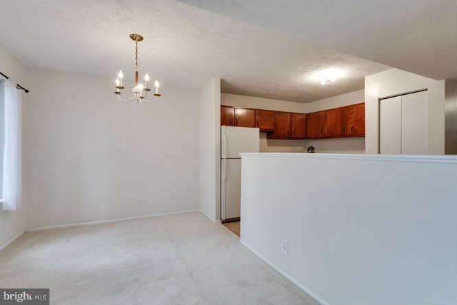 5049 7th Road South, Unit 302 Arlington, VA 22204 - Photo 15 of 26 a view of a kitchen with a refrigerator and a sink