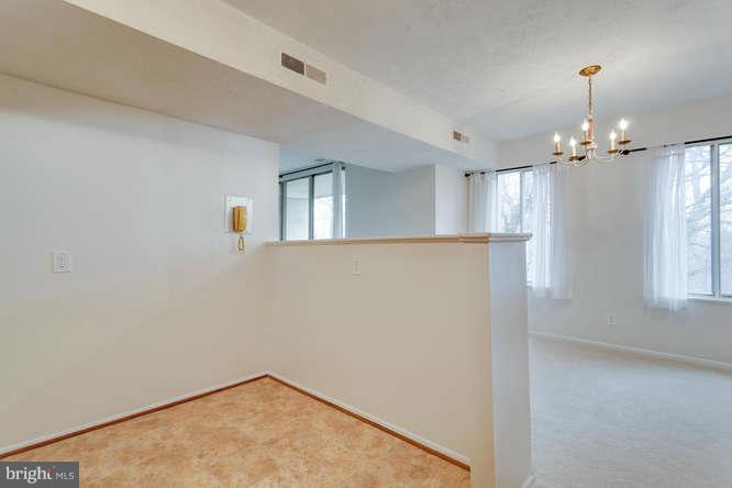 5049 7th Road South, Unit 302 Arlington, VA 22204 - Photo 20 of 26 wooden floor in an empty room with a window