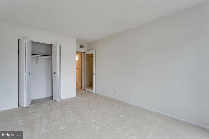 5049 7th Road South, Unit 302 Arlington, VA 22204 - Photo 21 of 26 a view of an empty room and closet area