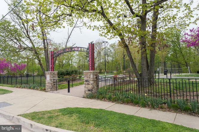 5049 7th Road South, Unit 302 Arlington, VA 22204 - Photo 25 of 26 a garden view with a fountain and trees
