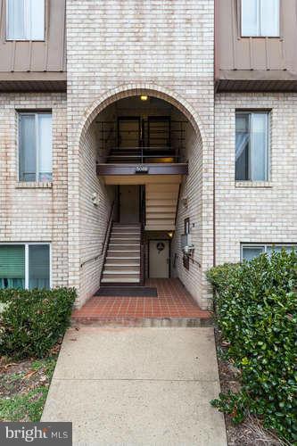 5049 7th Road South, Unit 302 Arlington, VA 22204 - Photo 4 of 26 a front view of a house with garage
