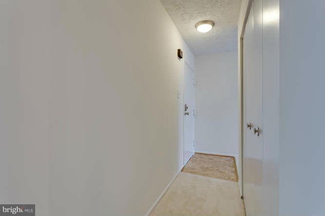 5049 7th Road South, Unit 302 Arlington, VA 22204 - Photo 7 of 26 a view of a hallway with wooden floor