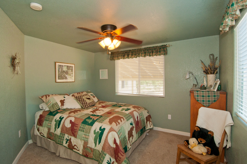 10672 Ridgetop Road Whitmore, CA 96096 - Photo 16 of 20 a bedroom with a bed and a window