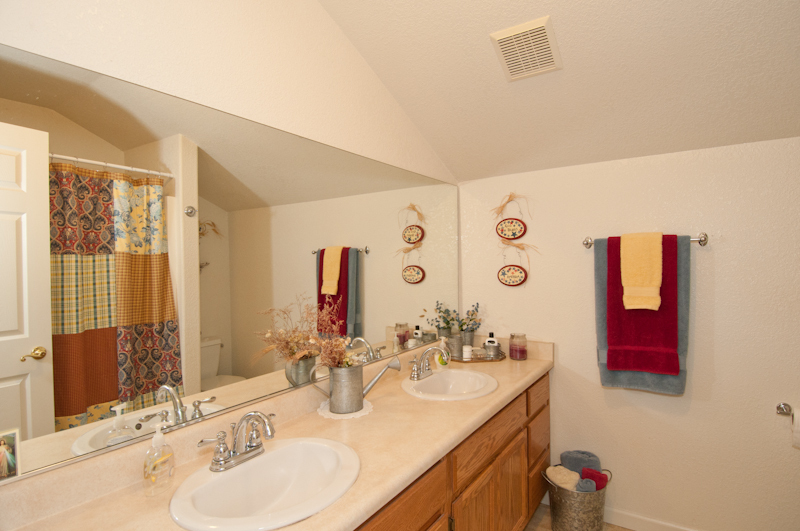 10672 Ridgetop Road Whitmore, CA 96096 - Photo 20 of 20 a bathroom with a sink double vanity and a mirror