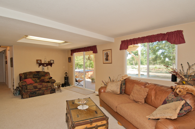 10672 Ridgetop Road Whitmore, CA 96096 - Photo 8 of 20 a living room with furniture and a large window