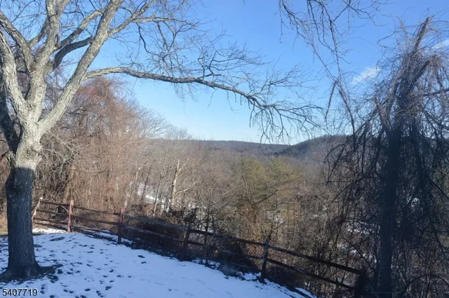 a view of mountain view with trees in the background