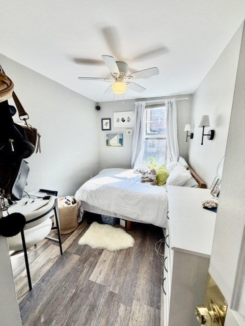 14 Cleveland Place, Unit 3 Boston, MA 02113 - Photo 6 of 22 a bedroom with a bed and wooden floor