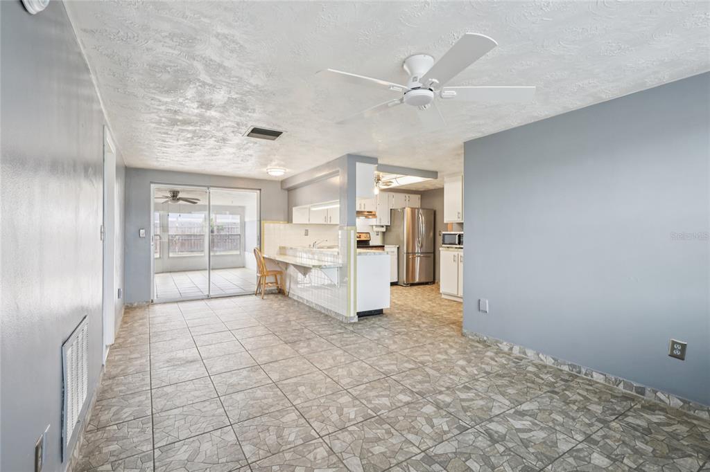 3548 Darlington Road Holiday, FL 34691 - Photo 10 of 32 a view of a kitchen with refrigerator and windows