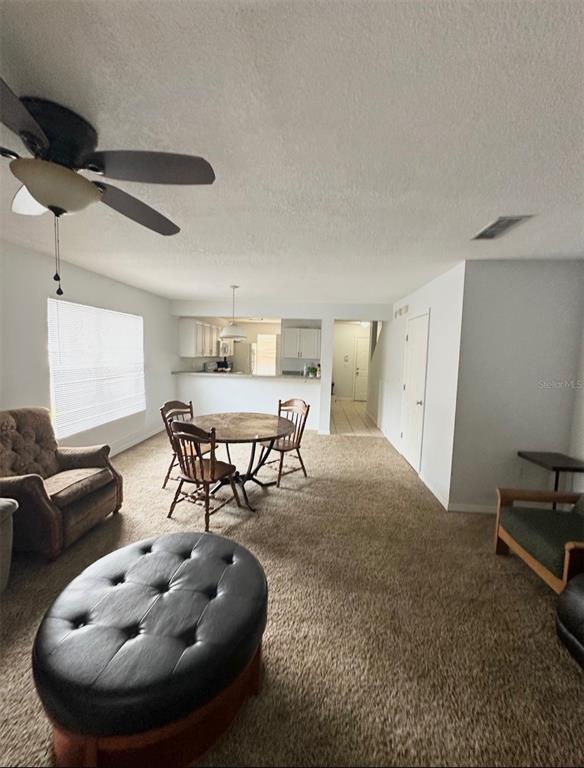 2306 Southwest 42nd Drive, Unit 140 Gainesville, FL 32607 - Photo 4 of 8 a living room with furniture and a large window