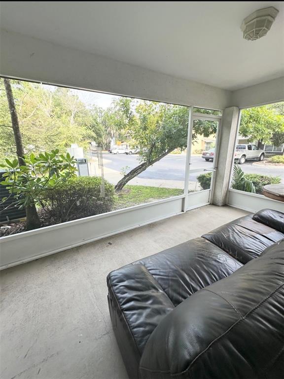2306 Southwest 42nd Drive, Unit 140 Gainesville, FL 32607 - Photo 7 of 8 a living room with furniture and a large window