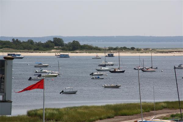 14 Clark Road Ipswich, MA 01938 - Photo 2 of 12 a view of a lake with couches and city view