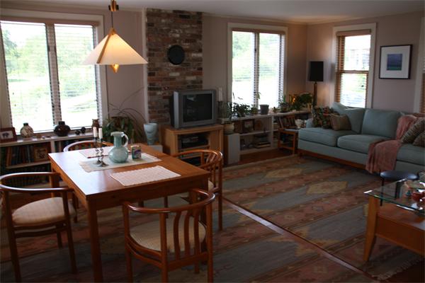 14 Clark Road Ipswich, MA 01938 - Photo 6 of 12 a living room with furniture a large window and a fireplace