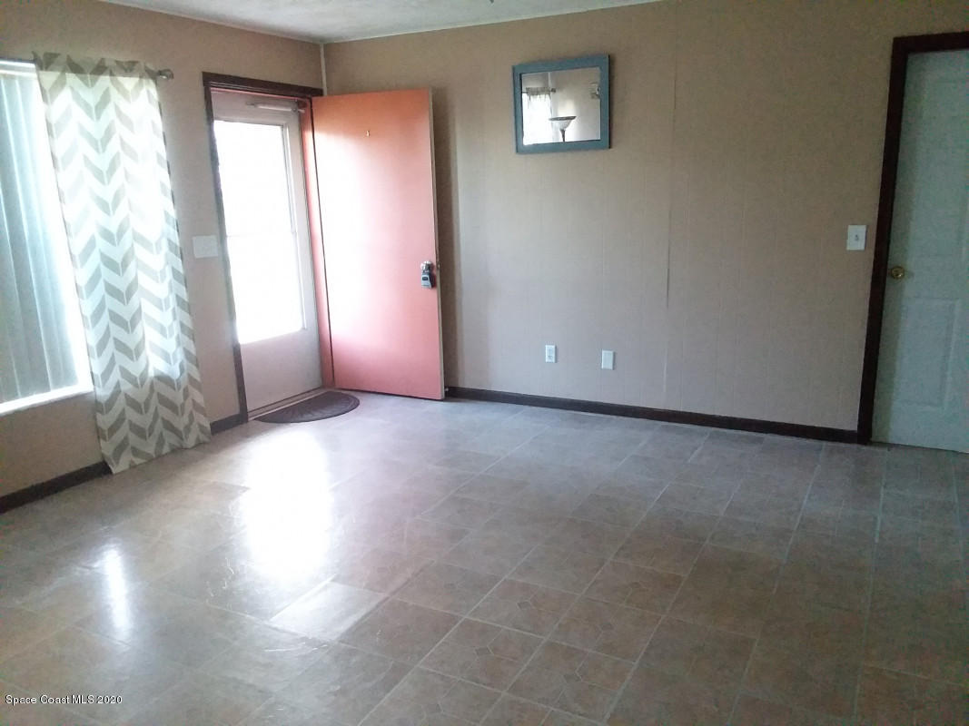 1030 Hibiscus Street Cocoa, FL 32927 - Photo 2 of 6 a view of an empty room and window
