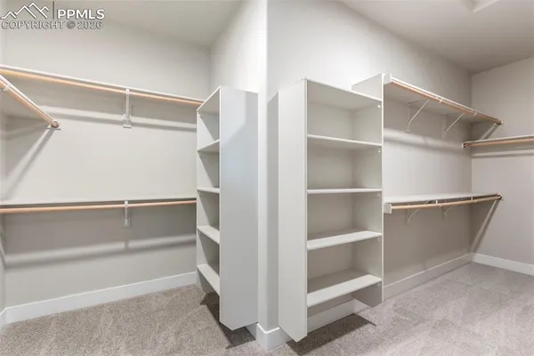 a view of an empty walk in closet