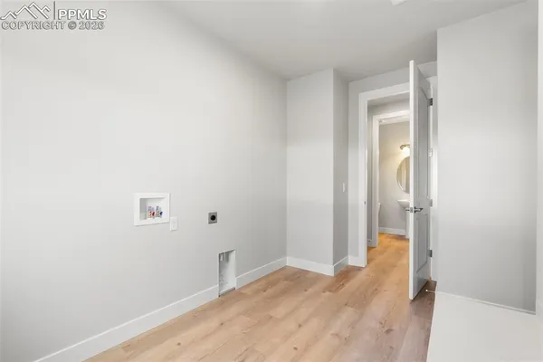 a view of a small space with wooden floor