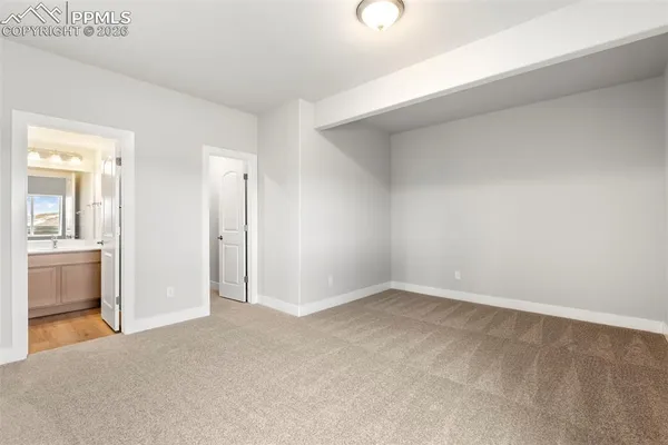 an empty room with a bathroom